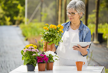 Image showing Working in a flower shop