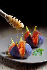 Image showing Ripe figs with honey 