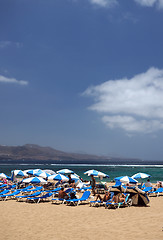 Image showing editorial  tourists sunbathe on popular Las Canteras Beach in La