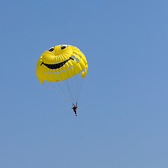 Image showing Parasailing in a blue sky