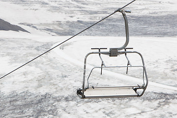 Image showing Empty ski lift above snow