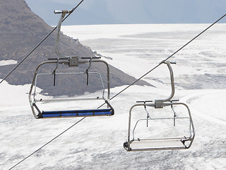 Image showing Empty ski lift above snow