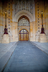 Image showing parliament in london old church door and marble antique  wall