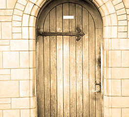 Image showing wooden parliament in london old church door and marble antique  