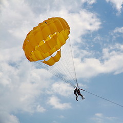 Image showing Parasailing in a blue sky near sea beach