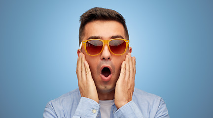 Image showing face of scared man in shirt and sunglasses