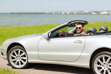 Image showing happy man driving cabriolet car outdoors