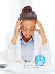 Image showing businesswoman working with calculator in office