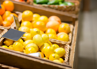 Image showing ripe lemons at food market