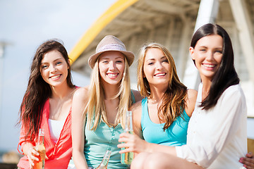 Image showing girls with drinks on the beach