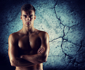 Image showing young male bodybuilder with bare muscular torso