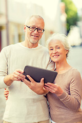 Image showing senior couple photographing on city street