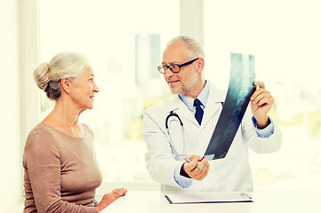 Image showing smiling senior woman and doctor meeting