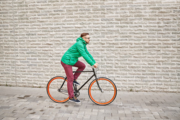 Image showing young hipster man riding fixed gear bike