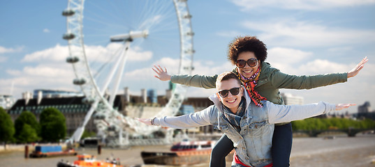 Image showing happy teenage couple having fun over london