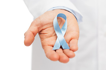 Image showing doctor hand with prostate cancer awareness ribbon