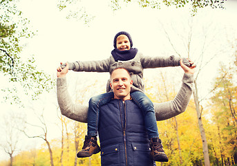 Image showing happy family having fun in autumn park