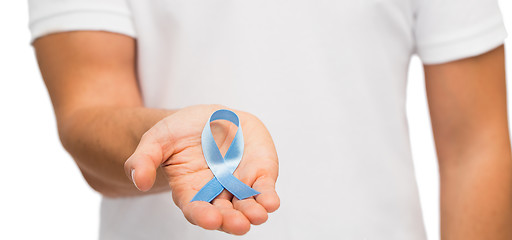 Image showing hand with blue prostate cancer awareness ribbon