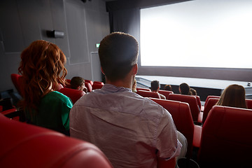 Image showing happy couple watching movie in theater or cinema