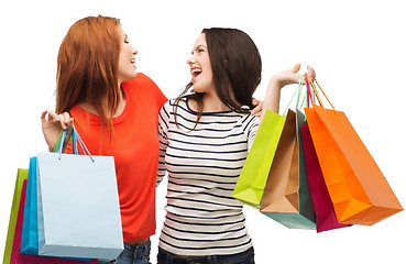 Image showing two smiling teenage girls with shopping bags