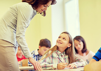 Image showing group of school kids writing test in classroom