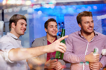 Image showing group of male friends with beer in nightclub