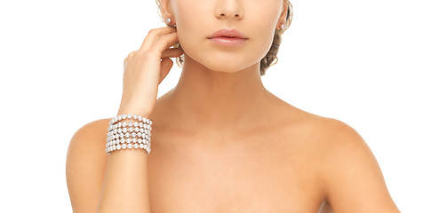 Image showing woman with pearl earrings and bracelet