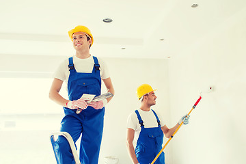 Image showing group of builders with tools indoors