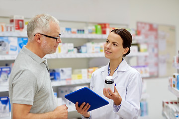 Image showing pharmacist with tablet pc and senior man