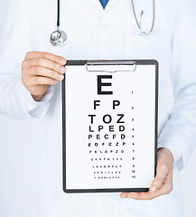 Image showing male ophthalmologist with eye chart