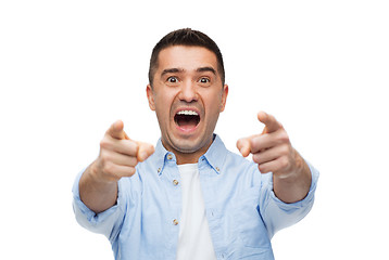 Image showing scared man shouting and pointing finger on you