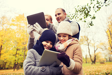 Image showing happy family with tablet pc in autumn park