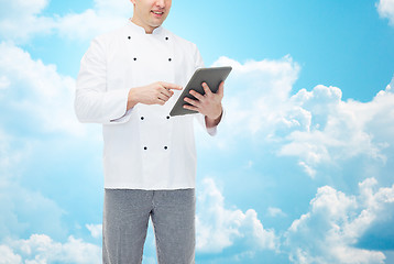 Image showing close up of happy male chef cook holding tablet pc