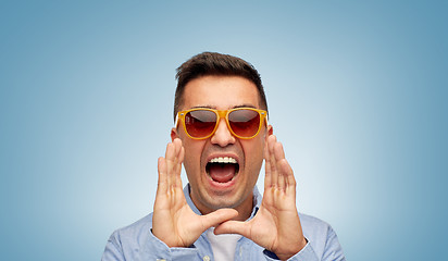 Image showing face of angry shouting man in shirt and sunglasses