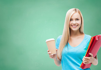 Image showing smiling student girl with folders and coffee cup