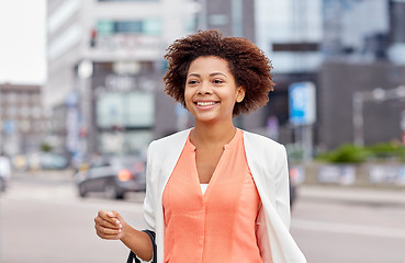 Image showing happy young african american businesswoman in city