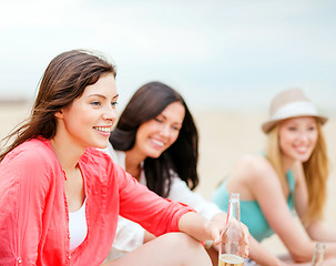 Image showing girls with drinks on the beach