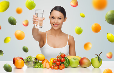 Image showing happy woman with healthy food showing water glass