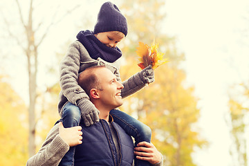 Image showing happy family having fun in autumn park