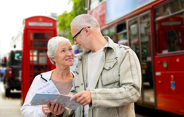 Image showing senior couple with map on london in city street