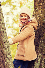 Image showing smiling little girl autumn in park