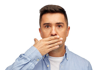 Image showing face of man covering his mouth with hand palm