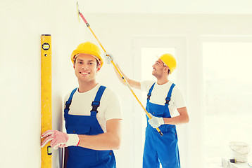 Image showing group of builders with tools indoors