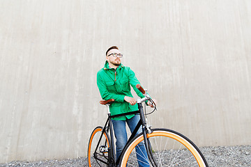 Image showing happy young hipster man with fixed gear bike