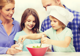 Image showing happy family with two kids eating at home