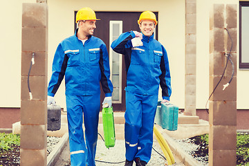 Image showing group of builders with toolboxes