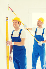 Image showing group of builders with tools indoors