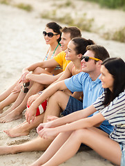 Image showing group of happy friends on beach