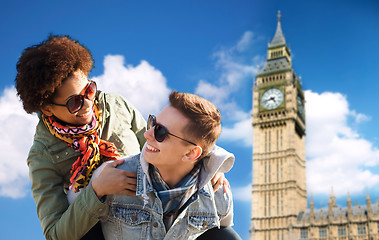 Image showing happy teenage couple having fun over big ben tower