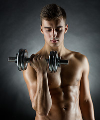 Image showing young man with dumbbell